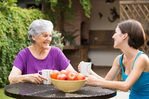 istock Senior having coffee with granddaughter 499872237