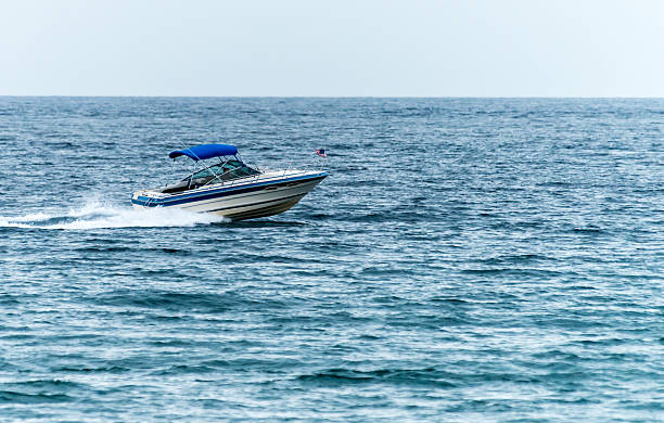istock Boat Racing on the Ocean 499873589