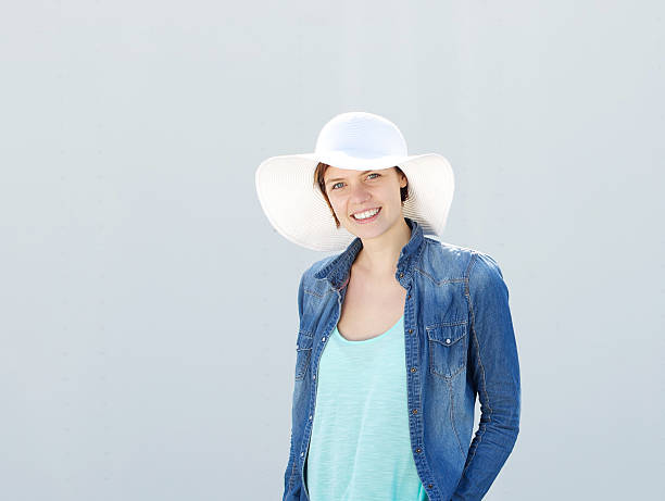 istock Young woman smiling with sun hat 499873869