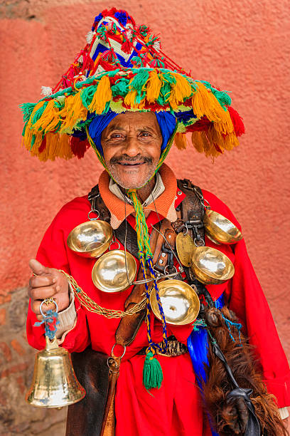 Portrait of water seller in Marrakesh, Morocco Moroccan water seller in traditional costume is selling water on Djemaa el Fna square, Marrakech, Morocco. Djemaa el Fna is a heart of Marrakesh's medina quarter.http://bem.2be.pl/IS/morocco_380.jpg djemma el fna square stock pictures, royalty-free photos & images