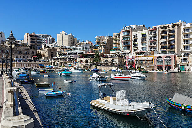 istock Several boats in a river near the city 499874629