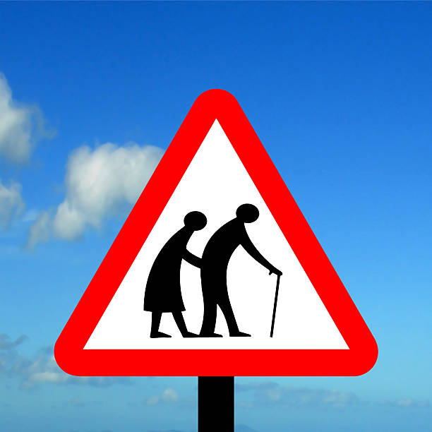Frail (or blind or disabled if shown) pedestrians likely to cross road ahead