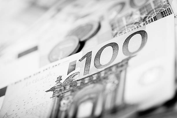 istock Closeup of banknotes and coins 499875104