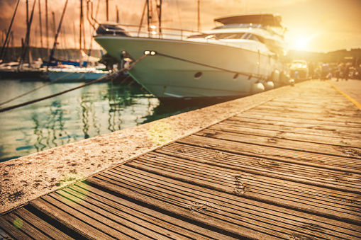 Background of pier with yachts and wood platform