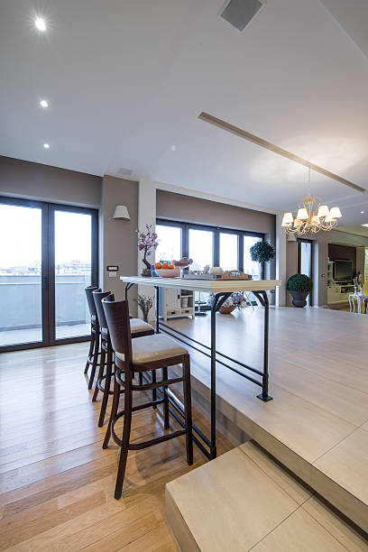 istock Interior of a modern apartment with bar table and chairs 499876632
