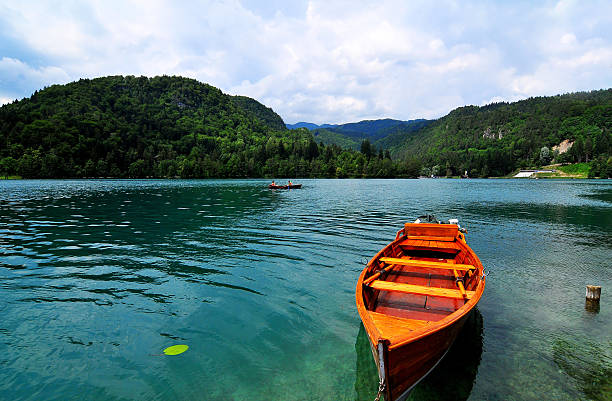 istock Lake Mountain Blue Sky And Boat From Slovenia 499880214