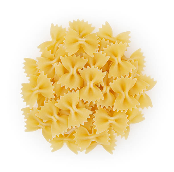 istock Bow tie pasta isolated on white background + clipping path 499880738