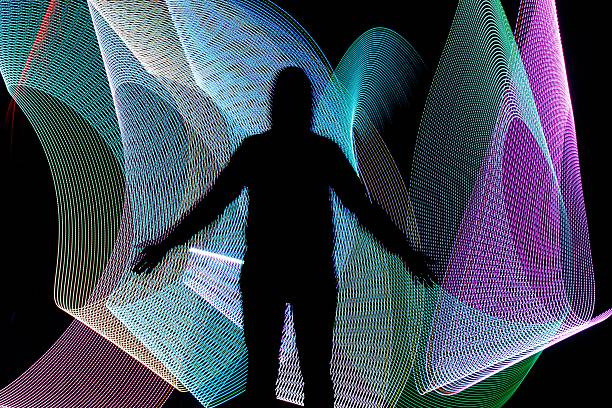 istock Silhouette in front of abstract freezelight background 499881858
