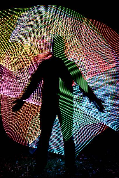 istock Silhouette in front of abstract freezelight background 499881896