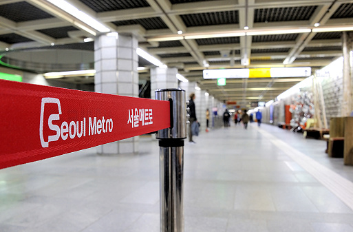 Seoul, South Korea - November 11, 2015 : Sign in the Metropolitan Subway of Seoul, one of the most heavily used underground system in the world, service 8 million passengers daily.Selective focus at the words Seoul Metro.November 11, 2015, Seoul, South Korea