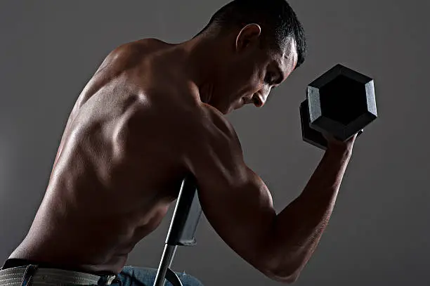 Photo of Handsome Asian male working out