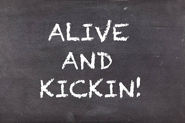 istock Alive and kickin, business motivational slogan 499885046