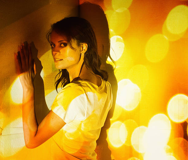 Woman covered by bokeh lightshttp://www.twodozendesign.info/i/1.png