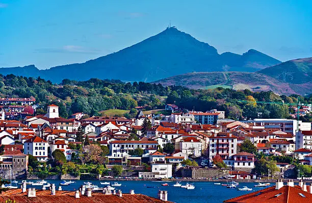 Cityscape of French border town Hendaye, as seen from Spanish Hondarribia, with Famous Rhune Mount at Background, Basque country, Province of Labourd, Atlantic Pyrenees, Aquitaine, France