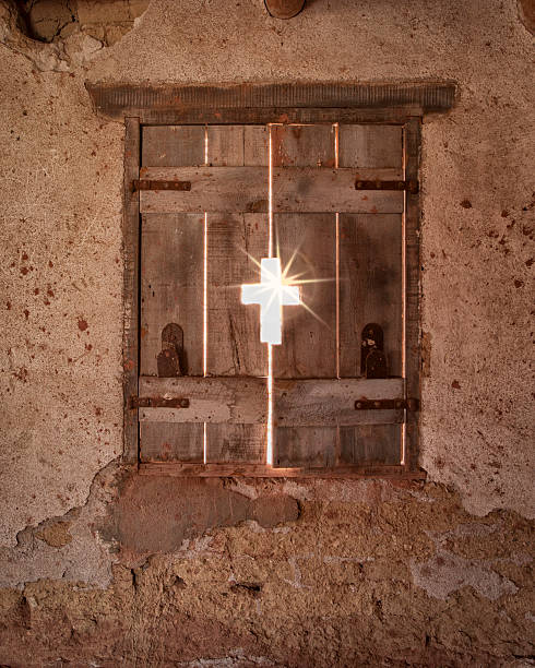 cross in wood with starburst stock photo