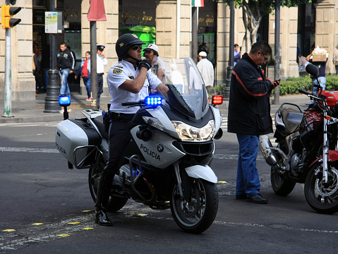 Mexico City, Mexico - November 24, 2015: Mexican Police Officer on Police Motorbike in Zócalo Square