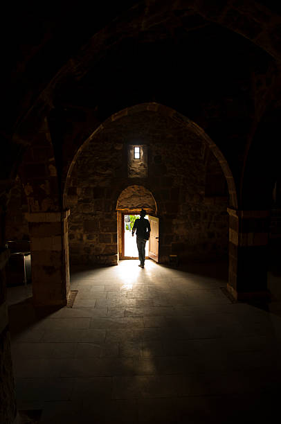 istock One person coming to light at the darkness 499888365