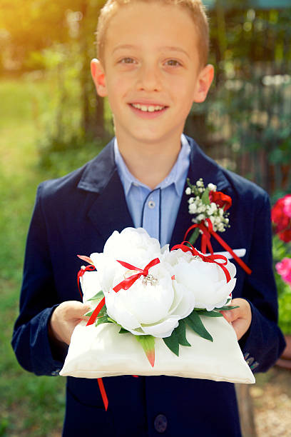 istock Page boy holding wedding rings 499888471