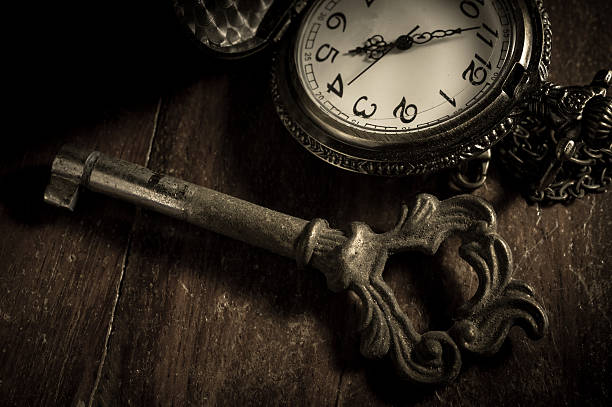 istock Old key with pocket watch,vintage filtered. 499888630