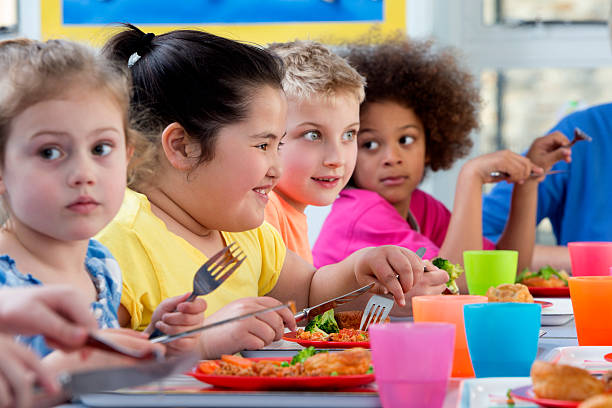 istock Children Eating School Dinners 499888643