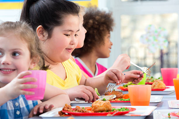 istock Children Eating School Dinners 499888655