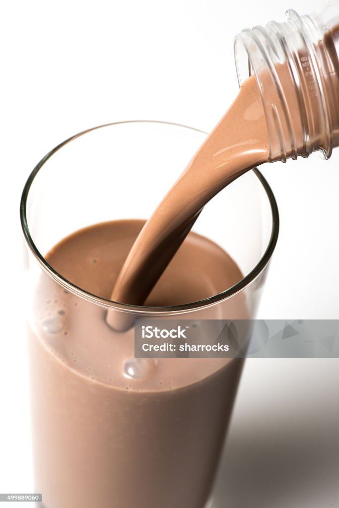 Chocolate milk Chocolate milk being poured from a plastic bottle into a glass. Chocolate Milk Stock Photo