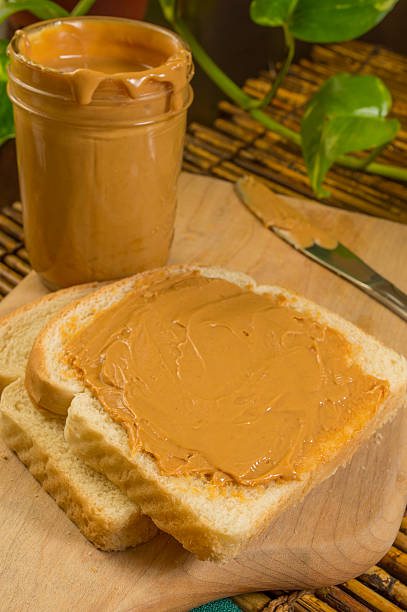 istock preparing a peanut butter sandwich 499889289