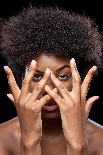 istock African beauty covering face with hands 499890203