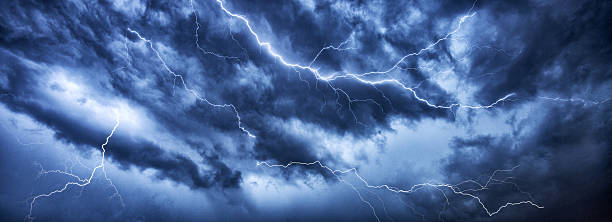 Lightning thunder bolt in dark thundercloud stock photo