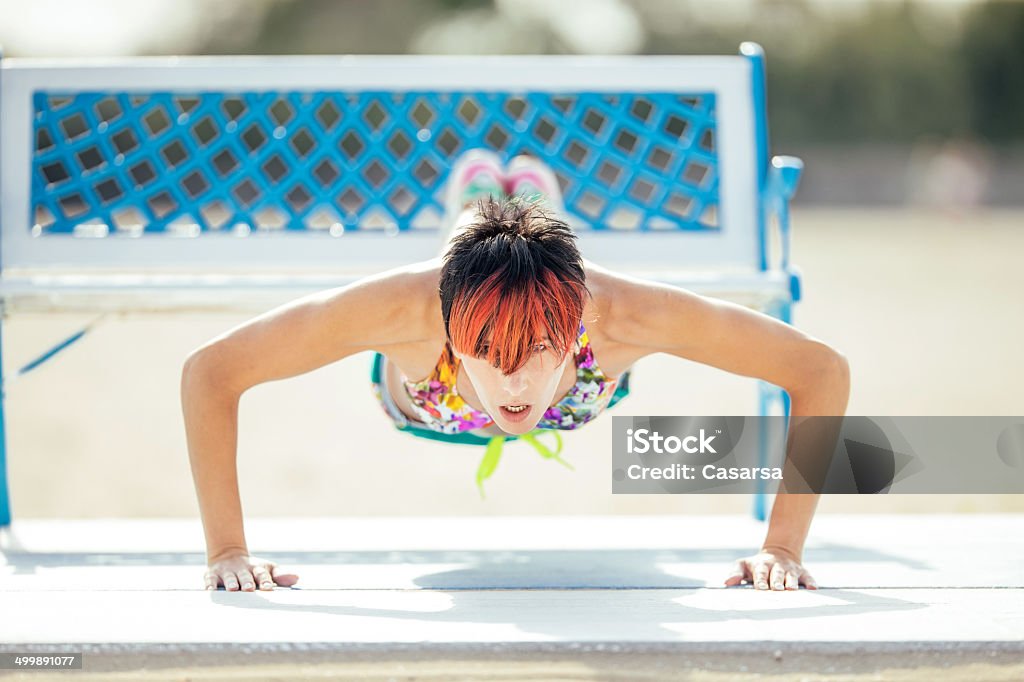Working out on the Beach Young woman Working out on the Beach Adult Stock Photo