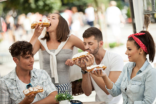 istock Friends Eating Waffles With Wanilla Cream 499891295