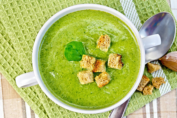 istock Soup puree with crackers and spoon on napkin 499891559