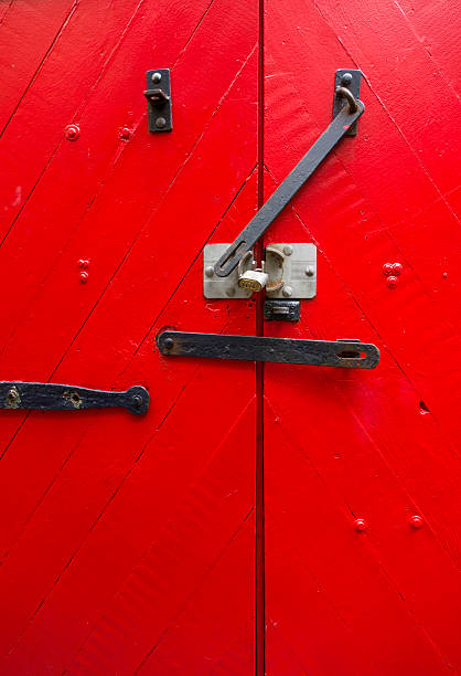 istock Bright Red barn Door with Wrought Iron hinges 499891687