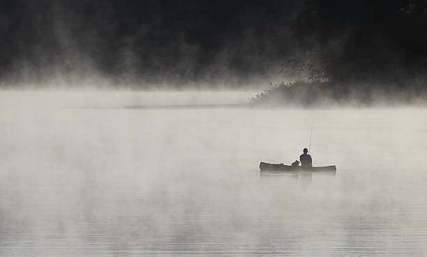 istock Fisherman and His Dog 499892047