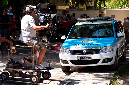 Rio de Janeiro, Brazil - February 1, 2014: Brazilian soap opera episode is being filmed in the street on 1 February 2014. Camera operator is shooting the scene.