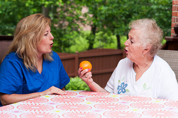 Stroke patient in apraxia speech therapy stock photo