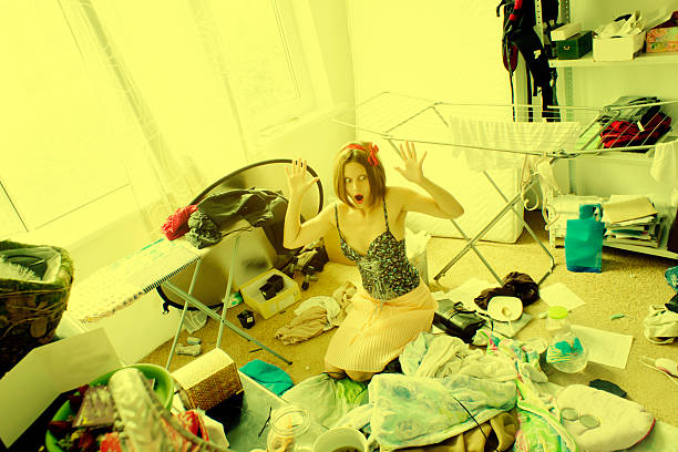 istock beautiful woman is expressing panic in her really messy room 499893655