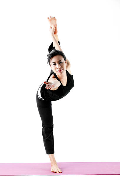 istock young beautiful yoga posing on a white studio background 499894203