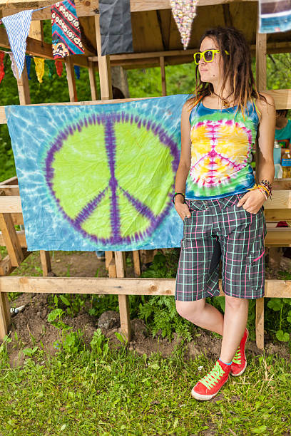 istock People in bright clothes with pacifist flag 499894349