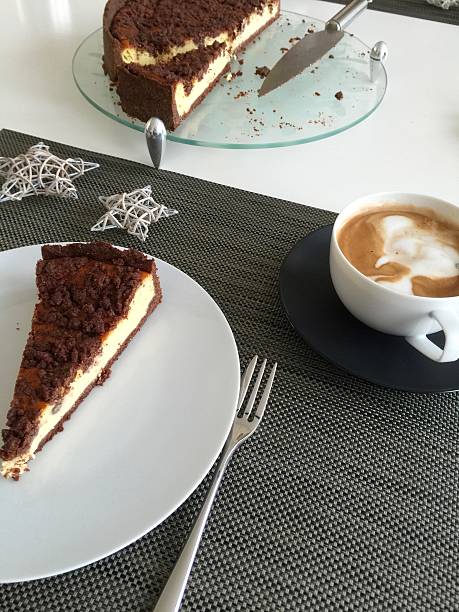 istock Cup of coffee and a plate with cheesecake 499901420