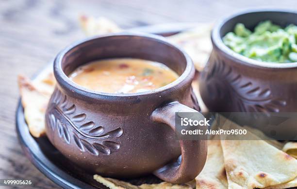 Bowls Of Guacamole And Queso With Tortilla Chips Stock Photo - Download Image Now - Appetizer, Avocado, Backgrounds