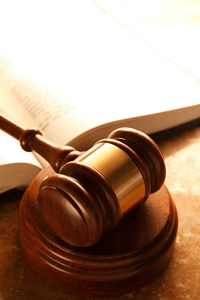 istock Gavel In Front Of Open Law Book 499906016
