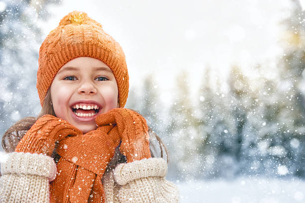 istock girl playing on a winter walk 499908390