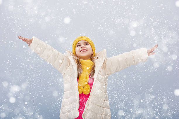 istock girl on a snowy winter walk 499908780