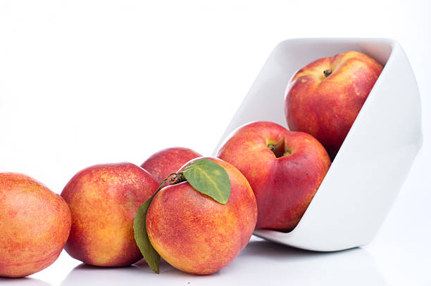 istock Nectarine friut on white isolated background 499909719