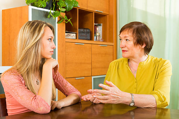 istock Mother with daughter talking seriously 499909843