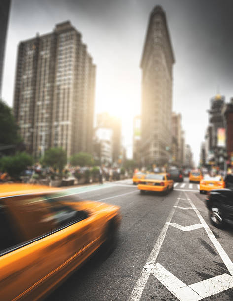 istock taxi running on manhattan 499910694