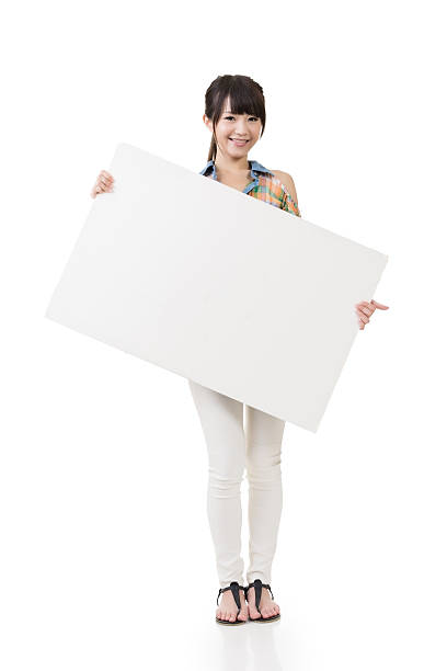 istock Attractive young asian woman holding blank board 499910811