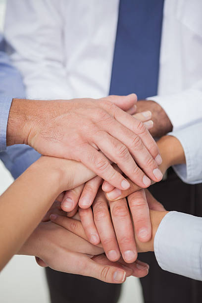 istock Close up on work teams hands all together 499910865