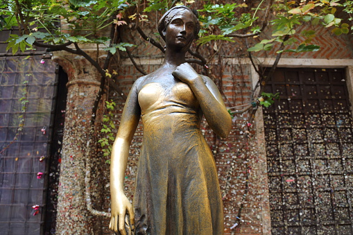 Verona, Italy - December 1, 2015: The bronze monument to the legendary Shakespeare's Juliet in Verona, Italy
